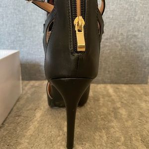 3 inch  cross strap with zipper black heel.